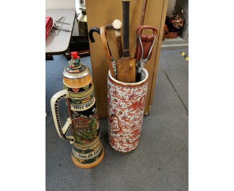 A Chinese ceramic stick stand, together with walking sticks, shooting stick, cricket bat and a large German stein Location: L