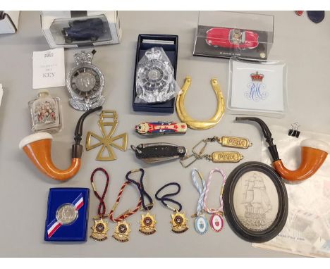 A mixed lot to include four guards polo enamel badges, two Henley badges, two pipes, two Royal Automobile Club badges, Chines