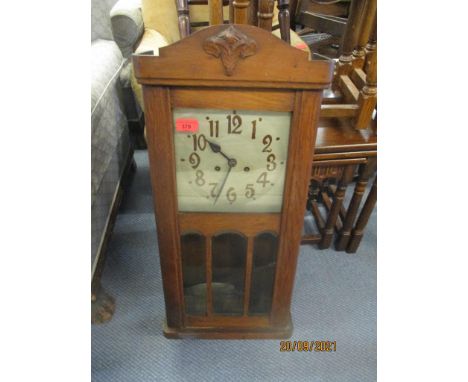 An early 20th century oak cased wall clock, and a 1930s mantel clock 
