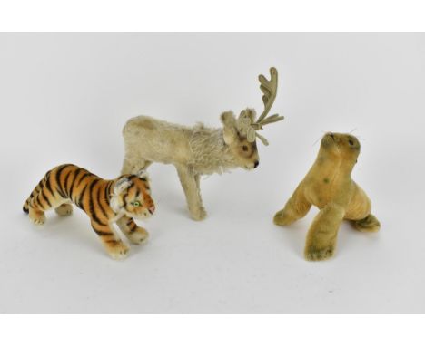 A Steiff seal with a label 17cm high, a reindeer 24cm high to top of antler, a tiger 28cm lCondition: no labels or buttons to