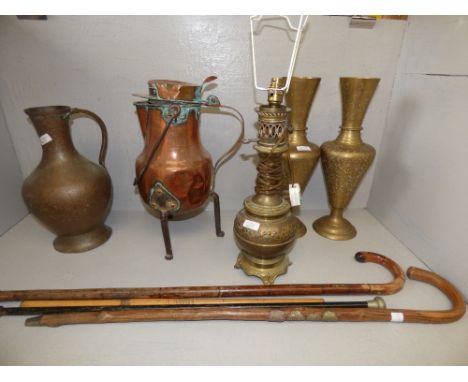 A pair of engraved brass vases, brass lamp, large copper & wrought iron jug and walking sticks etc. PLEASE ALWAYS CHECK CONDI