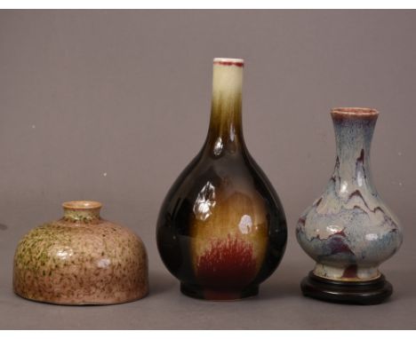 Chinese flambe glazed bottle vase, 18.6cm high; together with a peachbloom-glazed water pot incised with dragon roundels, Kan