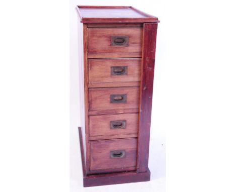 An early 20th century colonial pine wellington chest of drawers / filing cabinet. Raised on a plinth base, with locking foldi