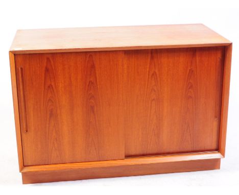Danish Modern Design - A mid century teak wood sideboard cabinet. Twin sliding doors with inset handles, adjustable shelf to 