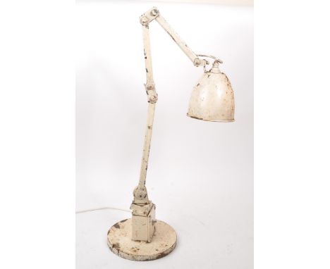 Early 20th century factory / office desk lamp light. White colourway with terraced and block base. Adjustable painted stem fi