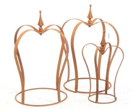 A pair of architectural salvaged wrought iron and cast garden post / gate mounted sculptures in the form of crowns. Each with
