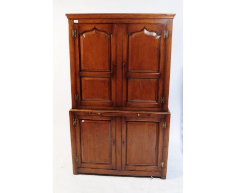 18th century revival Ipswich oak cocktail drinks cabinet. The top with arched fielded recessed panel twin doors over further 