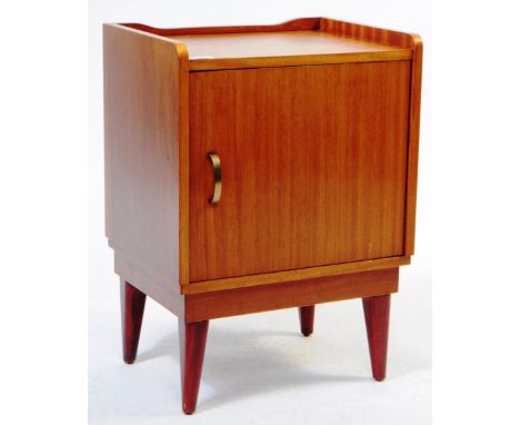 Austinsuite Furniture - Mid century teak wood bedside cabinet. Raisd on tapering supports with single locker cupboard door wi