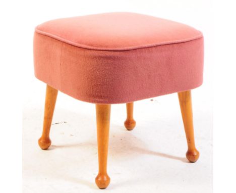 British Modern Design - Mid century upholstered foot stool pouffe. The footstool being raised on tapering legs with pad feet 