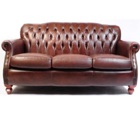 Thomas Lloyd Furniture - A contemporary chestnut brown leather three seat chesterfield sofa settee. The sofa upholstered in l