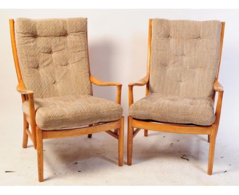 Parker Knoll - PK1016-19 - A pair of 20th century retro teak wood easy / lounge chair / armchair having a tall slatted ladder