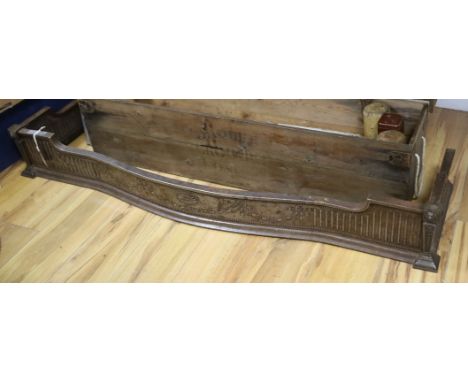A steel fender of serpentine form