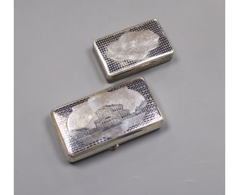 A 19th century Russian 84 zolotnik and niello cigarette case, decorated with Moscow? scene, dated 1873 and a similar earlier 