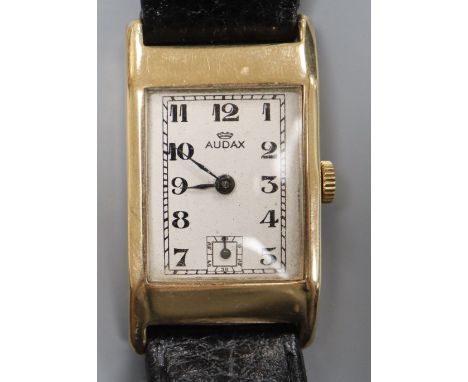 A gentleman's early 1940's 9ct gold Audax manual wind wrist watch, with rectangular Arabic dial and subsidiary seconds, on la