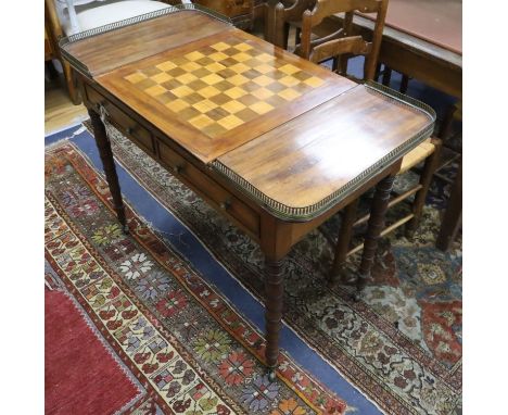 A Regency mahogany writing / games table with reversible leather lined chequer surface with interior backgammon W.100cm