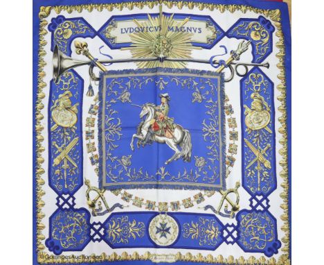   Three vintage Hermes silk scarves, 'Caparacons' (white ground), 'La Camargue' (red ground), and 'Ludovicus Magnus' (blue gr