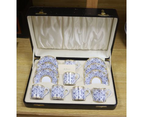   A cased Royal Worcester blue and gilt coffee for 6