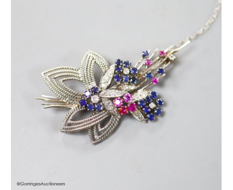  A modern white metal, ruby, sapphire and diamond set foliate spray brooch, 567mm,gross weight 11.2 grams.