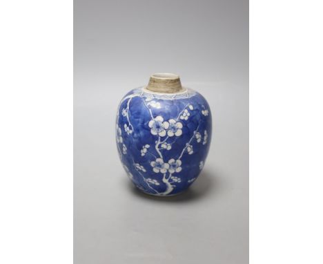   A Chinese Kangxi blue and white prunus jar, lacking cover, height 12cm
