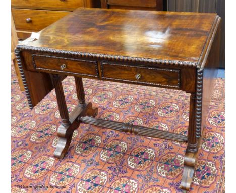   A 19th-century French rosewood sofa table, 86 cm wide with the leaves down, 61.5 cm deep, 75 cm high