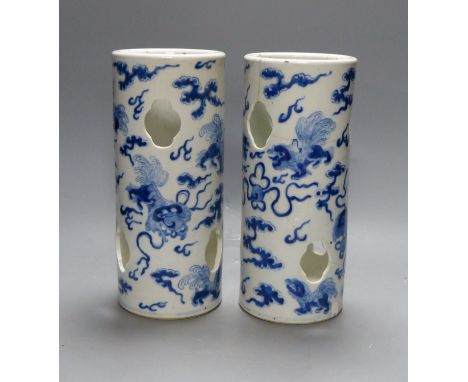   A pair of early 20th century Chinese blue and white hat stands, Kangxi marks, 29cm high