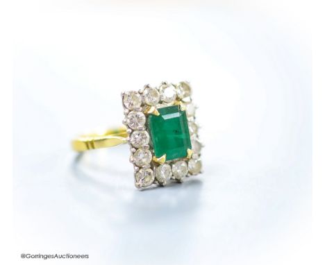   A modern 18ct gold, emerald and diamond set rectangular cluster ring, size K,gross weight 6 grams.