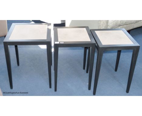   A pair of ebonised ash and parchment topped lamp tables, each 40 cm wide, 60 cm high, and a similar larger table 45 cm wide