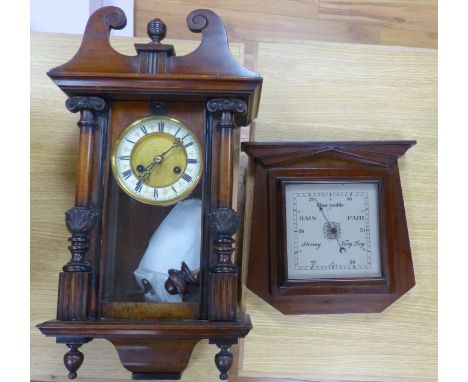   A 19th century German  walnut wall clock with pendulum and key, height 58cm, and a mahogany barometer