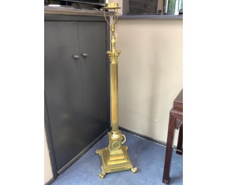 An early 20th century adjustable brass corinthian column lamp standard, minimum height 150cm