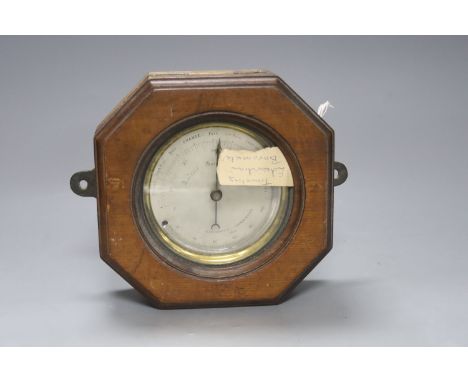   An Edwardian oak cased travelling aneroid barometer, height 19cm