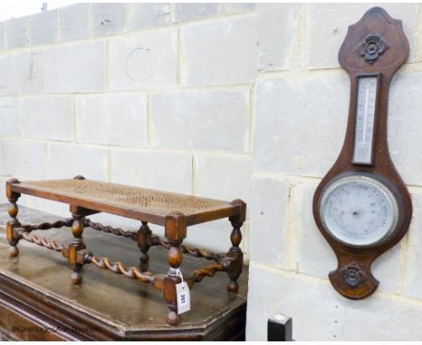   An oak footstool, width 76cm, depth 30cm, height 27cm and an aneroid barometer, length 58cm, width 19cm