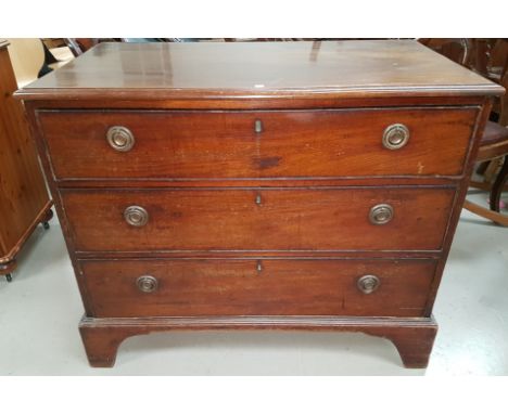 A Georgian 3 height mahogany chest of drawers with brass ring handles and bracket feet, width 39"