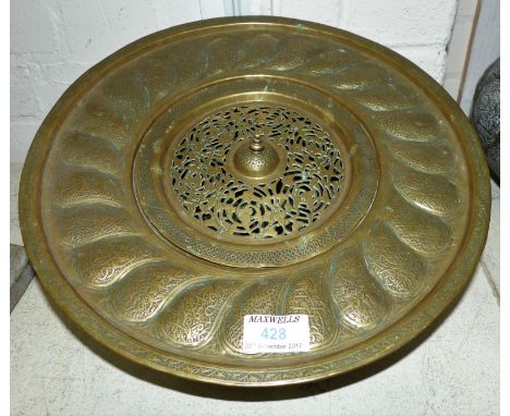 A Middle Eastern brass wash basin with central lid