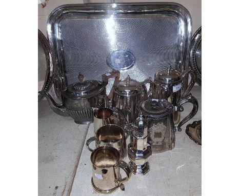 An engine turned tray with 4 piece tea set; other silver plate