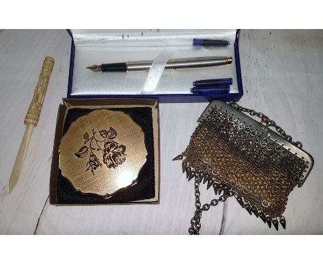A 19th century steel purse; a powder compact; a bone letter opener; a Waterman pen