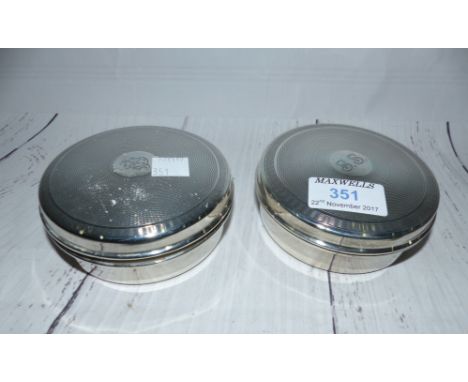 A pair of silver engine turned circular powder boxes, monogrammed, with plastic liners, Birmingham 1949
