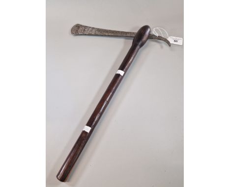 Probably 19th century African ceremonial axe, having engraved steel blade, with pierced and curved reverse angle, on a lignum