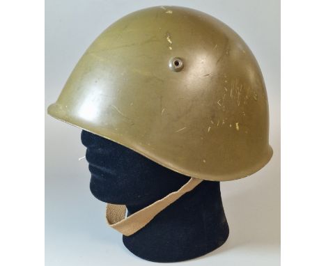 WWII style Italian steel helmet. Green paint finish. Steel headband with leather liner and canvas chinstrap. Stamped M69 to r