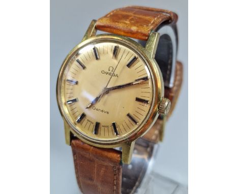 Omega Geneve gold plated manual gentleman's wristwatch, having gilt face with Baton numerals and sweep seconds dial, on Omega