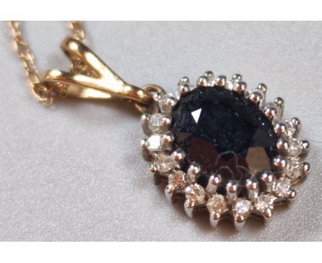 9ct gold fine link chain with diamond an sapphire multi cluster pendant. 2.3g approx.  (B.P. 21% + VAT)