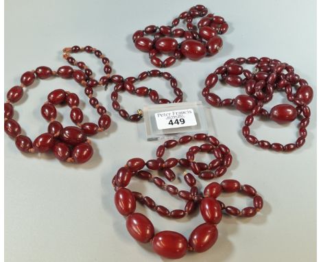Bag of four Art Deco red cherry amber type/Bakelite beaded graduated necklaces. 240g approx. (B.P. 21% + VAT)Images with ligh
