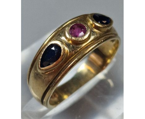 9ct gold three stone sapphire and ruby dress ring. 3.4g approx. Size M. (B.P. 21% + VAT)Clear hallmarks. Some scratches to th