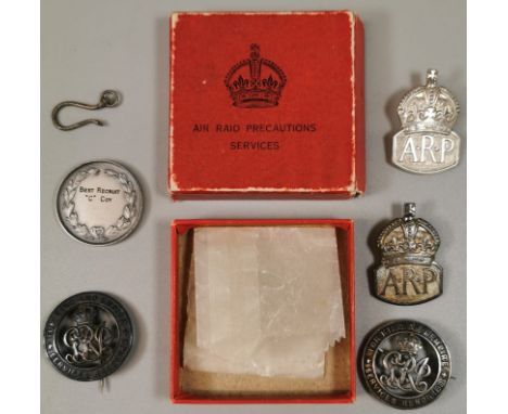 Two Silver War Badges - 1916 (marked 327170 and 371174) together with two silver A.R.P. (Air Raid Precaution) badges with Lon