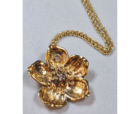 9ct gold fine link chain, with silver gilt 925 flowerhead pendant. The chain 1g approx.  (B.P. 21% + VAT)
