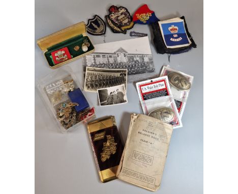 Box containing a collection of military cap badges and buttons (Royal Artillery, Welsh), assorted cloth patches, vintage phot