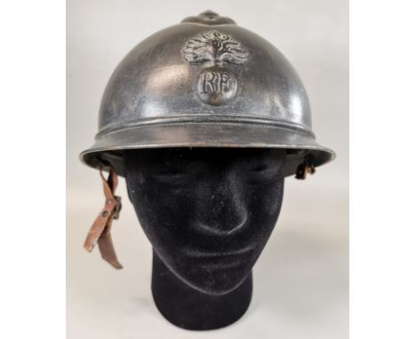 WWI French Infantry Adrian Pattern (M15) steel helmet. Horizon blue finish. Flaming bomb insignia. Original leather liner, pa