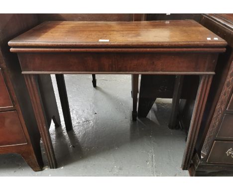 19th century mahogany fold-over card table, the green baize above fluted legs. (B.P. 21% + VAT)