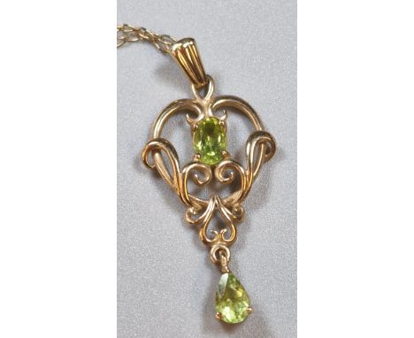 Art Nouveau gold and peridot pendant, on 9ct gold fine link chain, in velvet heart shaped box. The chain 45cm long approx. Th
