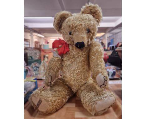 Large vintage Merrythought teddy bear, with glass eyes, stitched nose and moveable limbs. (B.P. 21% + VAT)Height - 53cm appro