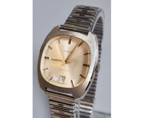 1970s Garrard presentation automatic steel wristwatch, with satin face, having Baton numerals and date aperture. Presentation
